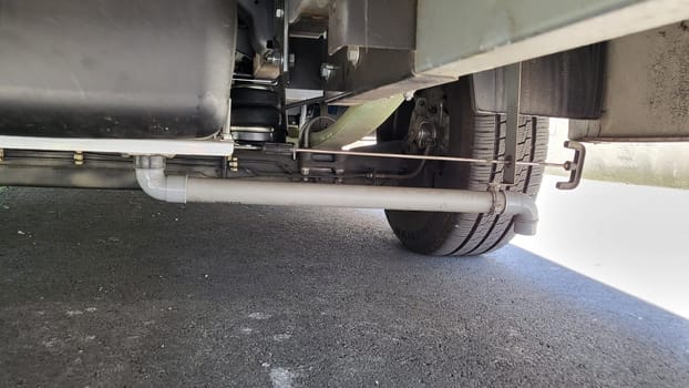 VELBERT, NRW, GERMANY - June 16, 2022: Installation of an additional air suspension in a mobile home to increase the load capacity