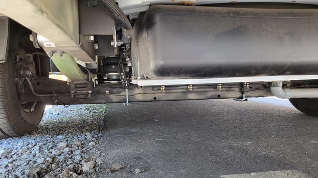 VELBERT, NRW, GERMANY - June 16, 2022: Installation of an additional air suspension in a mobile home to increase the load capacity