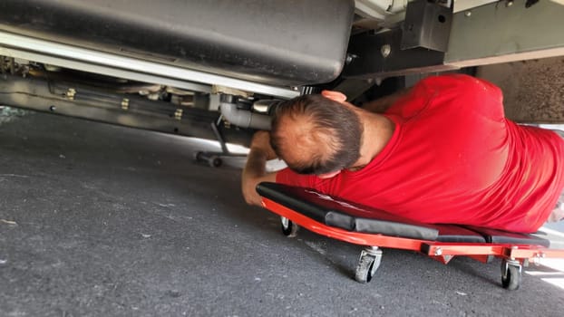 VELBERT, NRW, GERMANY - June 16, 2022: Installation of an additional air suspension in a mobile home to increase the load capacity