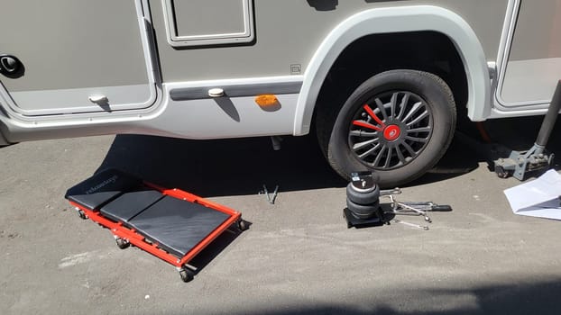 VELBERT, NRW, GERMANY - June 16, 2022: Installation of an additional air suspension in a mobile home to increase the load capacity