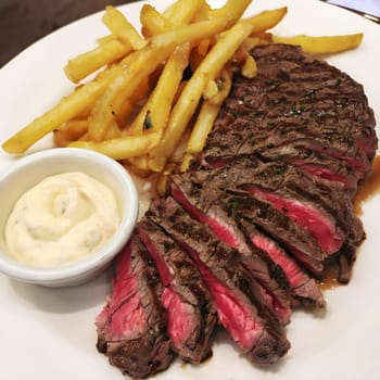 Classic Steak and Fries: Thinly Sliced Steak with a Side of Aioli