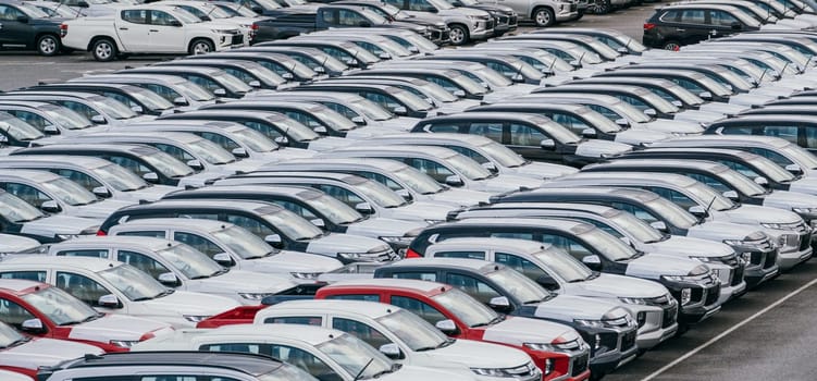 Lamchabang, Thailand - July 02, 2023 Efficient loading and transportation of brand new cars from the factory's crowded warehousean essential part of global marketing.