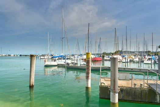 Constance, Germany – July 30, 2024: Sailing boats in the marina of Constance on Lake Constance in Germany on a warm summer's day