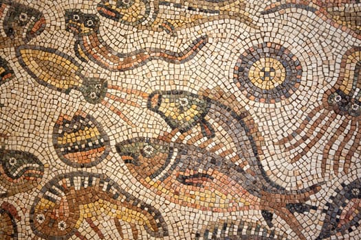 Close up of a mosaic on the floor of an old Roman villa