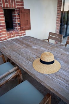 Straw hat on a wooden table