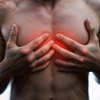 Young male experiencing chest pain with red radiating effect.