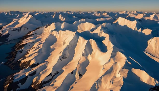 Golden Glimpse: Antarctic Peaks in Warm Light and Blue Shadows