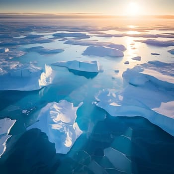 An aerial view of polar icebergs drifting in dark blue waters, sunlight casting turquoise highlights and reflections beneath the ice.