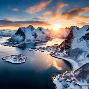 A mesmerizing aerial winter view of Norway's Lofoten Islands, where soft sunlight warms snowcapped peaks against icy blue fjords.
