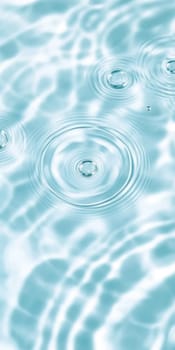Ripples in clear blue water with abstract circular patterns, suitable as calming SPA background, AI generated
