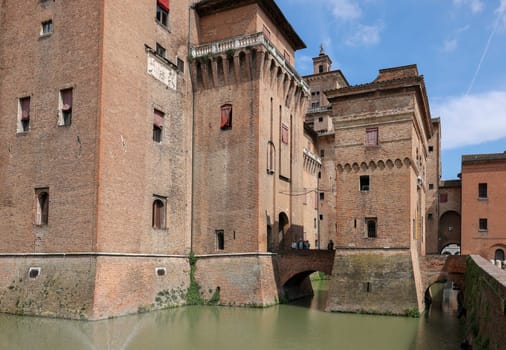 Ferrara, Italy - May 8, 2024: Castle Estense, a four towered fortress from the 14th century, Ferrara, Emilia-Romagna, Italy