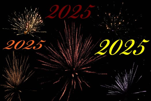 Turn of the year 2025 with various New Year's Eve rockets in the black sky