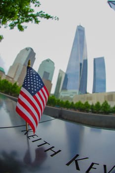 american flag and skyscraper. Shooting Location: new york, manhattan