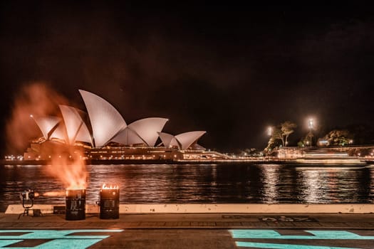 burning flame and opera house. Shooting Location: sydney, australia