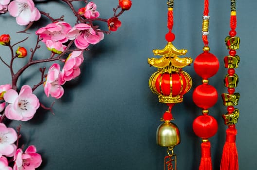 Chinese New Year decoration on black cover background with customizable space for text. Chinese New Year celebration concept.