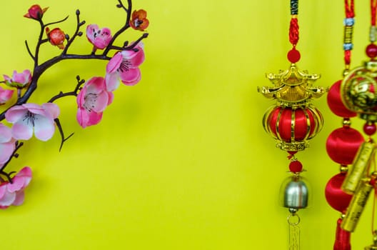 Chinese New Year decoration with on yellow cover background with customizable space for text. Chinese New Year celebration concept.