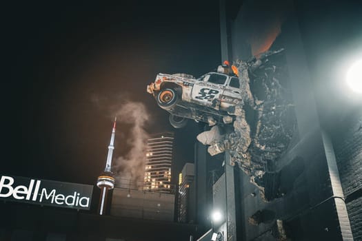 Art of a car crashing through a wall. Shooting Location: Toronto