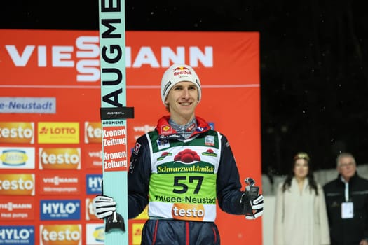 Daniel Tschofenig USV Achomitz / Aut) is happy about his third place at the FIS Ski Jumping World Cup Individual Men in Neustadt