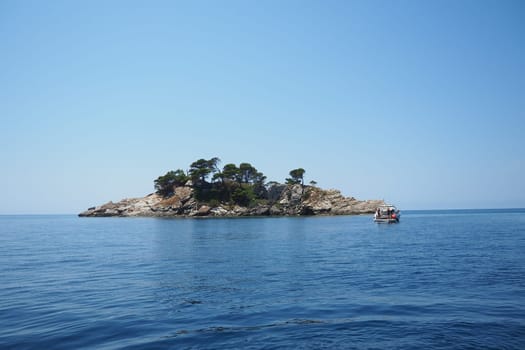 Petrovac, Montenegro, 07.27.24: Katic and Sveta Nedelja are two small islets on the Adriatic Sea, located opposite of the town of Petrovac in the Montenegrin municipality of Budva. Church on the rock.