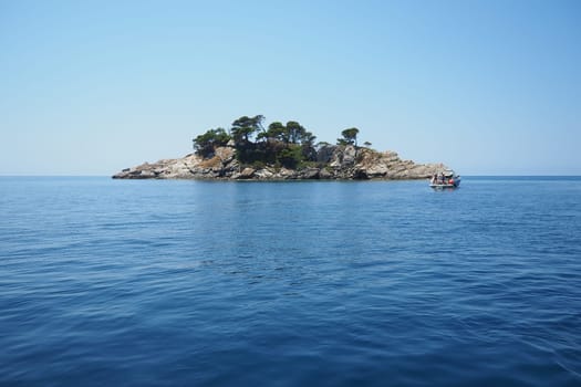 Petrovac, Montenegro, 07.27.24: Katic and Sveta Nedelja are two small islets on the Adriatic Sea, located opposite of the town of Petrovac in the Montenegrin municipality of Budva. Church on the rock.