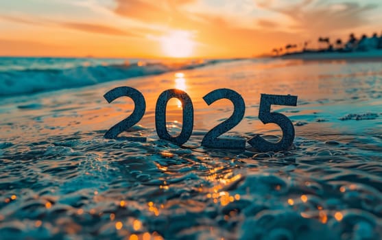 Wooden figures of '2025' are washed over by gentle waves on a sandy beach at dawn. The image symbolizes the fresh beginnings of a new year with the promise of a bright horizon
