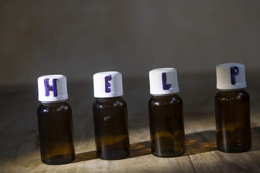 help healthy concept with medicine bottles and te written on their caps