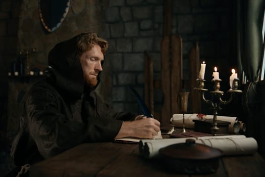 Medieval monk chronicler writing ancient sacred manuscript under candlelight in dark monastery cell