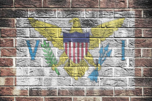 A US Virgin Islands flag on a brick wall background