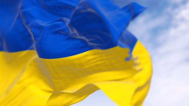 Close-up of Ukraine national flag waving on a clear day. Two horizontal bands of blue on top and yellow on the bottom. 3d illustration render. Rippling fabric. Selective focus