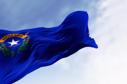 Nevada state flag waving in the wind on a clear day. Cobalt blue field with a state emblem on the top left. 3d illustration render. Rippled fabric