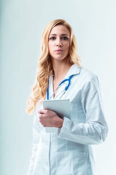 Woman medic with tablet, copyspace, uses medical apps for telehealth, blood tests, patient data, healthcare service info