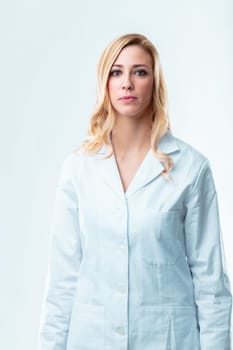 Blonde woman in white coat, skilled and knowledgeable, desires to use expertise for human good, skeptical of ethical overlook