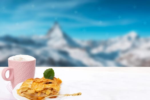 Apple roll served. A slice of homemade baked fresh apple strudel with a cup of coffee on a bright table over abstract blurred mountain background. Morning coffee. Space.