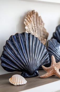 A collection of ceramic sea shell decorations in various shapes and colors, arranged neatly on a wooden shelf with starfish accents.