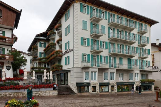 Cortina d'Ampezzo, Italy - September 6, 2024: Corso Italia -  Pedestrian Zone and Main Street in the Center of Cortina d Ampezzo, a Famous Skiing Resort in the Dolomites