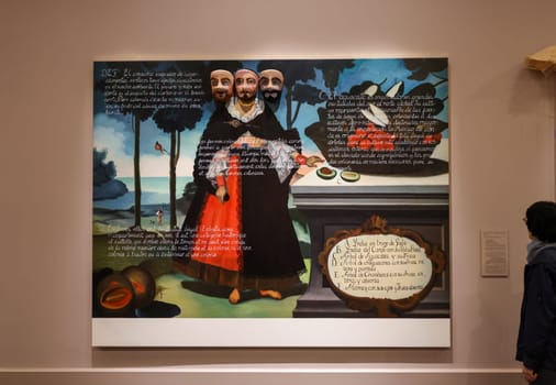 Venice, Italy - May 7 2024: 60th Art Biennale in Venice. Miscegenation Masks I, portrait of an Indigenious Woman from Quito with fruit. Oil, Jauja, Peru. Carnival mask and gold leaf on canvas