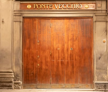 Florence, ITALY - JULY 28, 2024: Old Bridge - Ponte Vecchio - goldsmith shop entrance. This shop is located on the Old Bridge.