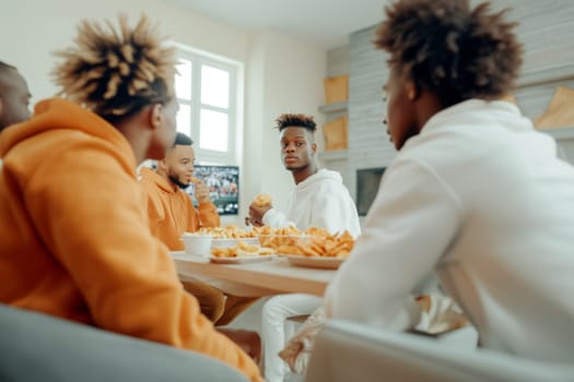 Friends watching Super Bowl football game eating snacks together at home, AI generated