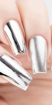 Metallic silver chrome nails closeup with rhinestone accents, vertical background, AI Generated