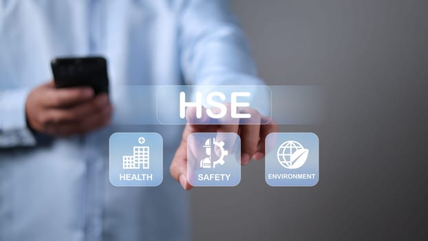 HSE, Health safety environment concept, Standard safe industrial work and industrial, Businessman touch virtual HSE icon for business and organization, Safety and protection in industrial work.