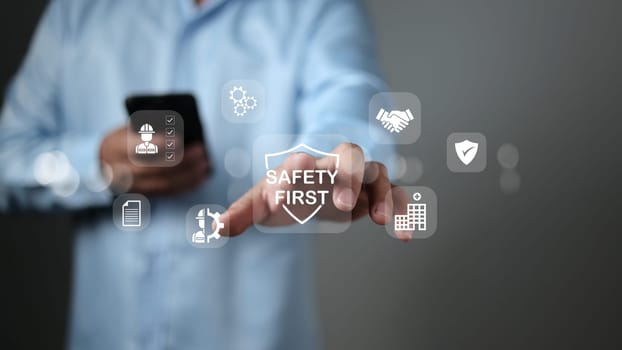 Safety first and work safety concept. Work safety concept, Concept safety first as a priority in professional environments, Safety first, Regulations and group insurance, Working standard process.