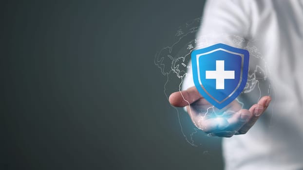 The concept of health insurance and medical welfare, Man is holding plus icon represents protection Receiving benefits, Health insurance and access to treatment, Health care planning
