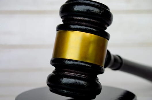 Close up of lawyer's gavel with customizable space for text. Laws and regulations concept