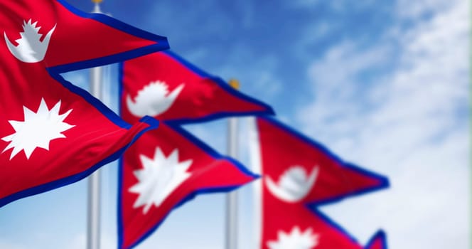 Close-up of Nepal National flag waving in the wind on a clear day. The only Non-quadrilateral national flag in the world. 3d illustration render. Rippling fabric. Selective focus