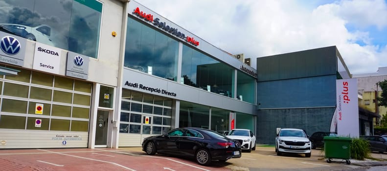 Lloret de mar, Spain - September 30, 2024: Audi dealership seen from outside. Audi AG is a German automotive manufacturer of luxury vehicles headquartered in Ingolstadt, Bavaria, Germany.