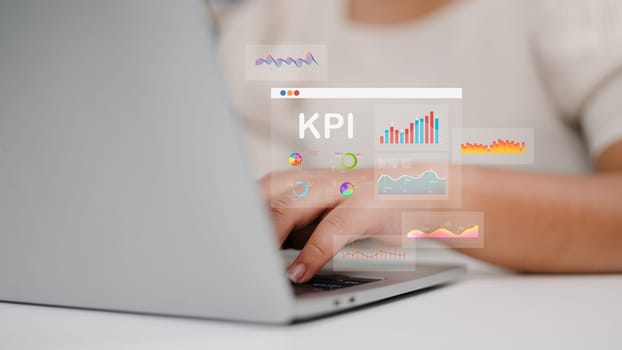 Women use laptops to analyze key performance indicators with various graphs and charts, Showcasing data analysis, and performance tracking. KPI, Key Performance Indicators Analysis.