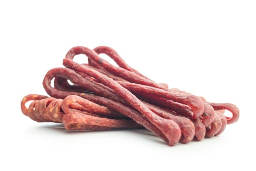 Smoked kabanos. Mini dried thin sausages isolated on a white background