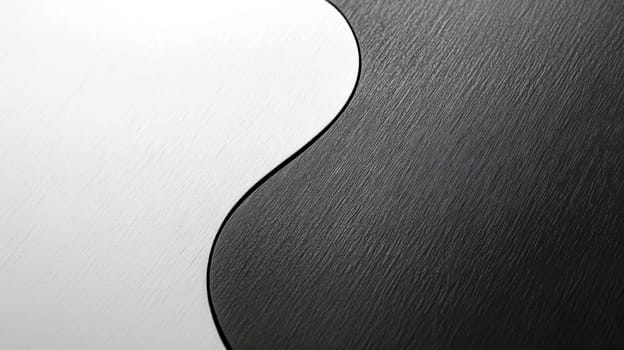 Close up view of a yin yang symbol, emphasizing the striking contrast and balance between black and white, illustrating the harmony of opposing forces and their interconnectedness