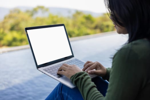 Woman use laptop and looking at it, Blank screen tablet with white background for advertising text, Woman using laptop contact business search information, Marketing and creative design.
