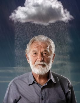 Pessimistic old man standing under rain, with a storm cloud over head. Concept of losing memory, Alzheimer's and dementia disease. Cloudy and moody thoughts